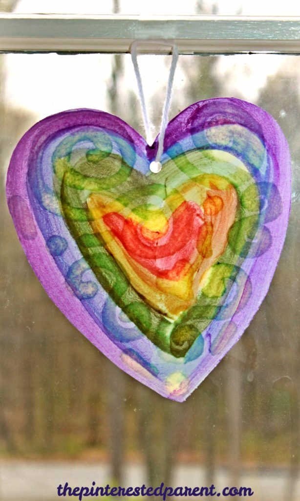 Oil resist watercolor suncatcher paintings - this is an easy arts & craft project for kids or adults. The oil produces a lovely effect after painted