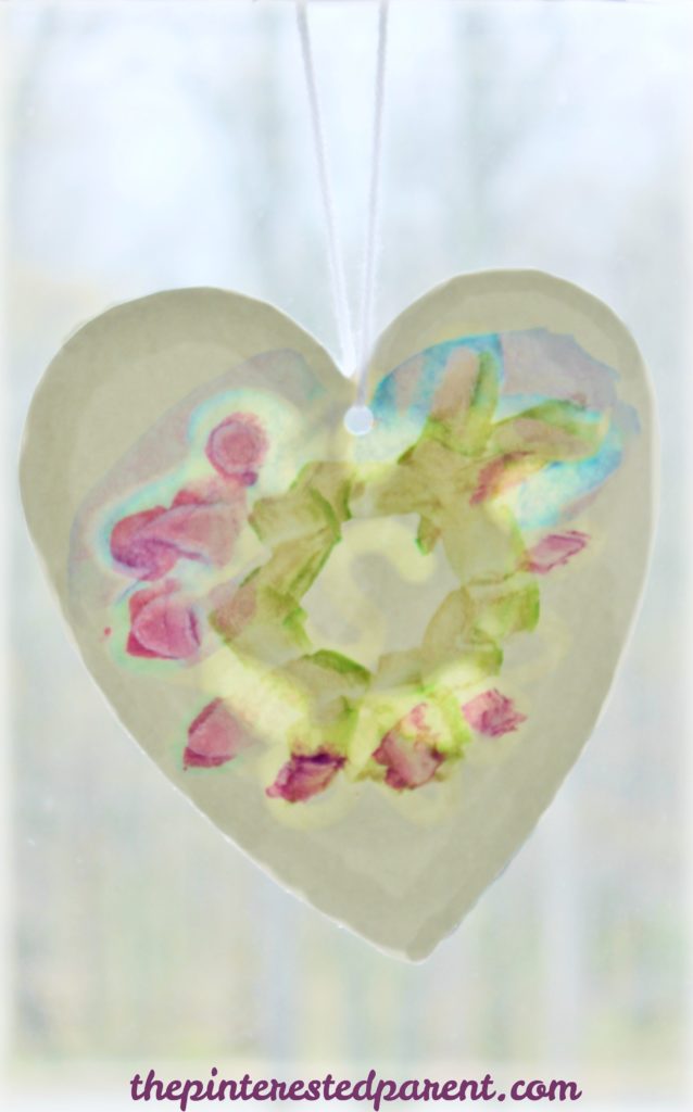 Oil resist watercolor suncatcher paintings - this is an easy arts & craft project for kids or adults. The oil produces a lovely effect after painted