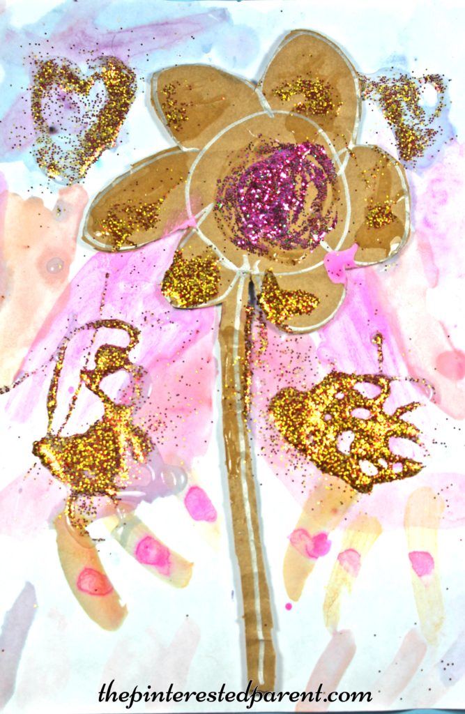 Glittery cardboard flower on watercolor paints - a pretty spring or summer arts & crafts project for the kids