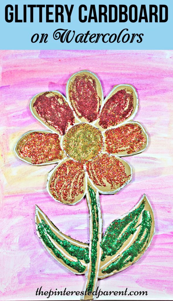 Glittery cardboard flower over watercolor paints - a pretty spring or summer arts & crafts project for kids.