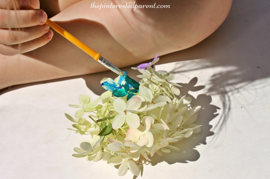 Painting flower petal - nature arts & crafts activities for kids. This is a wonderful spring & summer art project that you can do outdoors. Great for all ages.