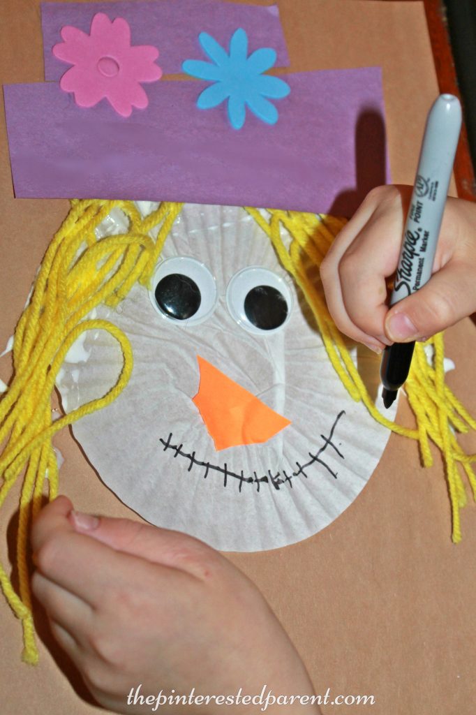 Cupcake Liner Scarecrow Craft - fall autumn arts & crafts for kids . Halloween projects