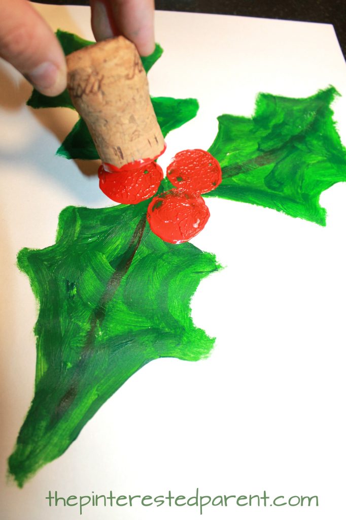 Cork stamped and painted holly. Winter and Christmas arts and crafts for kids and preschoolers. Cork stamping
