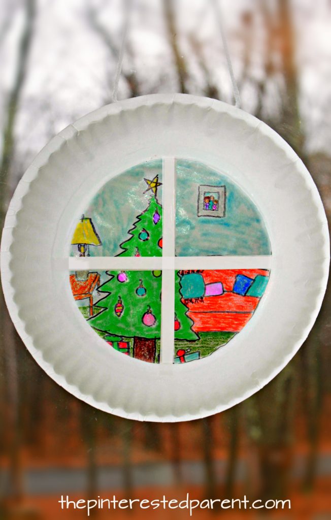 Paper plate sun catcher Christmas window scene. holiday and winter arts and crafts for the kids. Wax paper and SHarpies