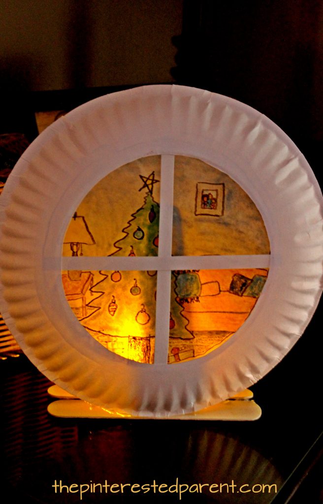 Paper plate sun catcher or luminary Christmas window scene. holiday and winter arts and crafts for the kids. Wax paper and SHarpies