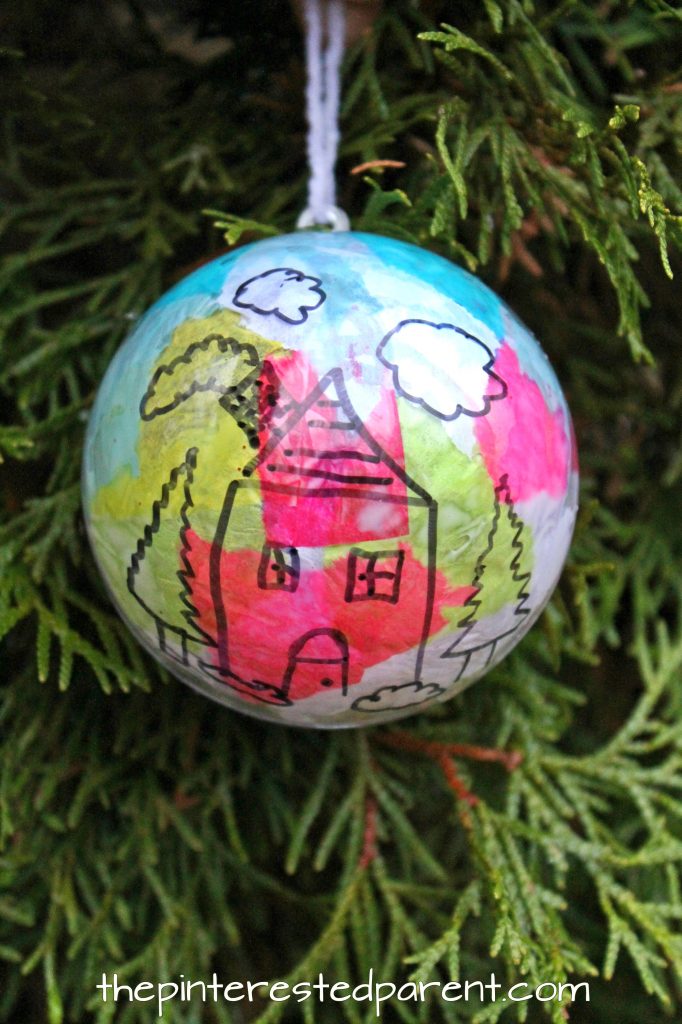 What would be better on your Christmas tree than a hand drawn ornament made by your child. Christmas and winter arts and crafts. Easy kid made ornaments with Sharpie and tissue paper..
