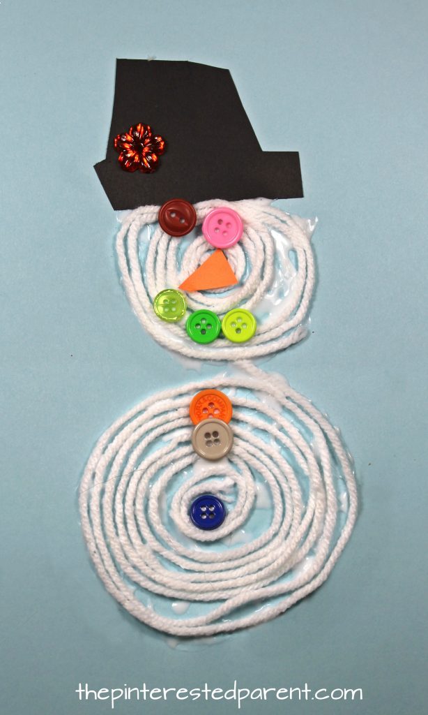 Coiled Yarn Snowman Craft - kid's arts and crafts for Christmas and winter. A great fine motor skill activity. Button embellishments