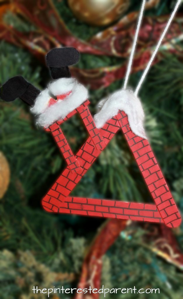 Popsicle Stick Roof Top Ornament with Santa stuck in the chimney - Christmas arts and crafts. Crafts stick projects for kids