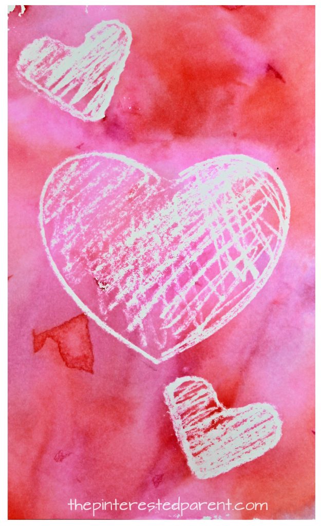 Crayon resist bleeding tissue paper painted hearts for Valentine's Day. Kid's arts and crafts ideas. Great for preschoolers