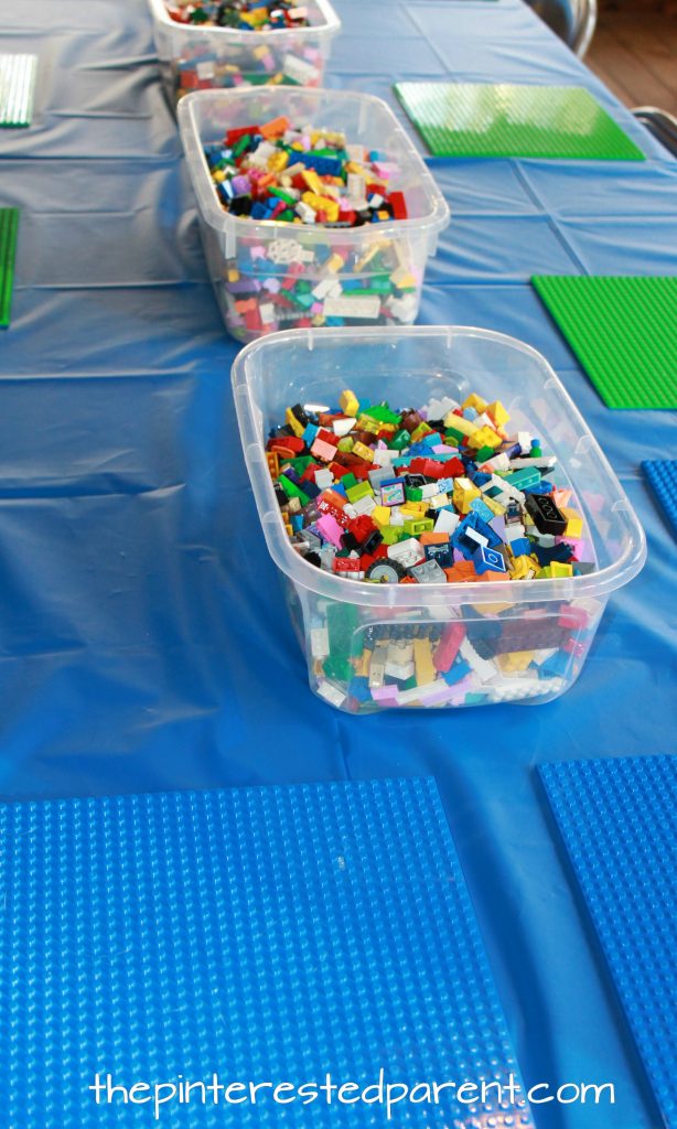 Lego activity table for a Lego themed birthday party for kids. Use Lego plates and buckets of Legos.