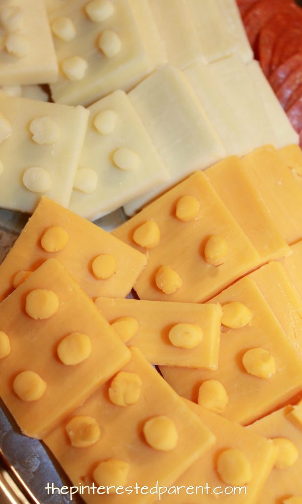 Lego cheese and cracker platter for a Lego themed party for the kids. Check out other food, decorations and activities. Party food recipe ideas.