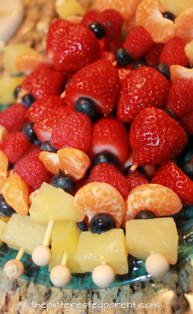 THese fruit skewers are perfect for a kid's birthday party. No sharp ends for the kids to poke themselves with.