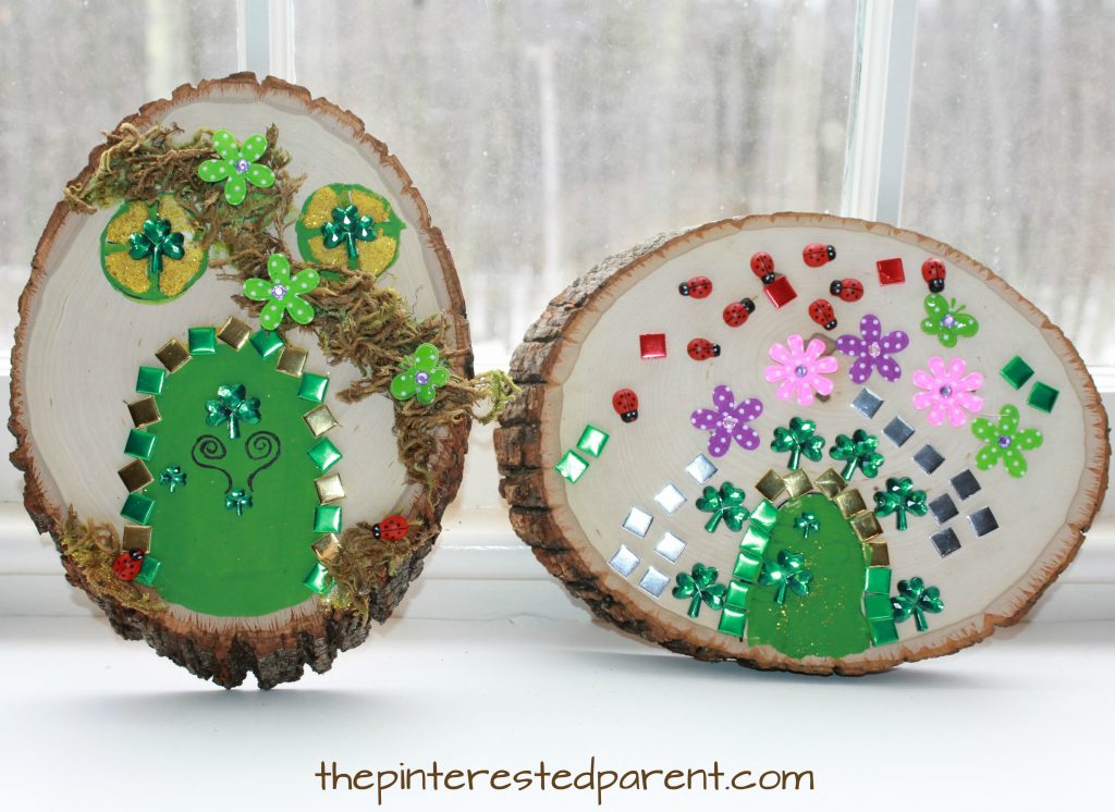 Wood Slab Leprechaun house and door. St Patrick's Day arts and crafts for kids. Paint, stickers, nature and gemstones made these pretty doors.