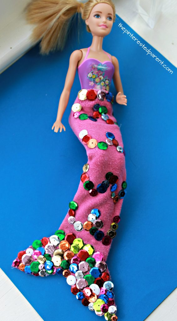 Use an old tube sock and some sequins to make this mermaid tail for your Barbie. Arts and crafts for your kids