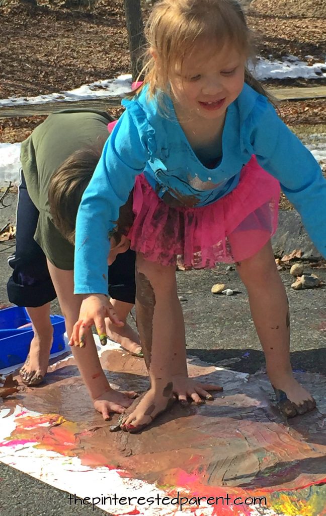 Messy paint play for the kids. Paint with hands and feet. Messy process art & play