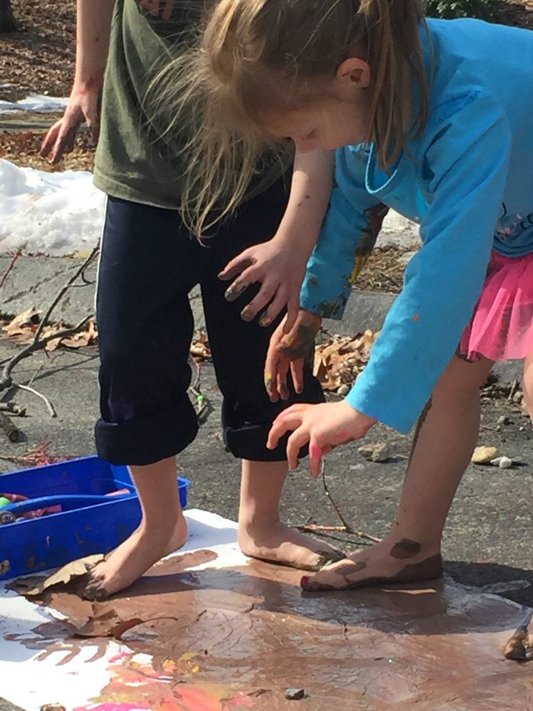 Messy paint play for the kids. Paint with hands and feet. Messy process art & play