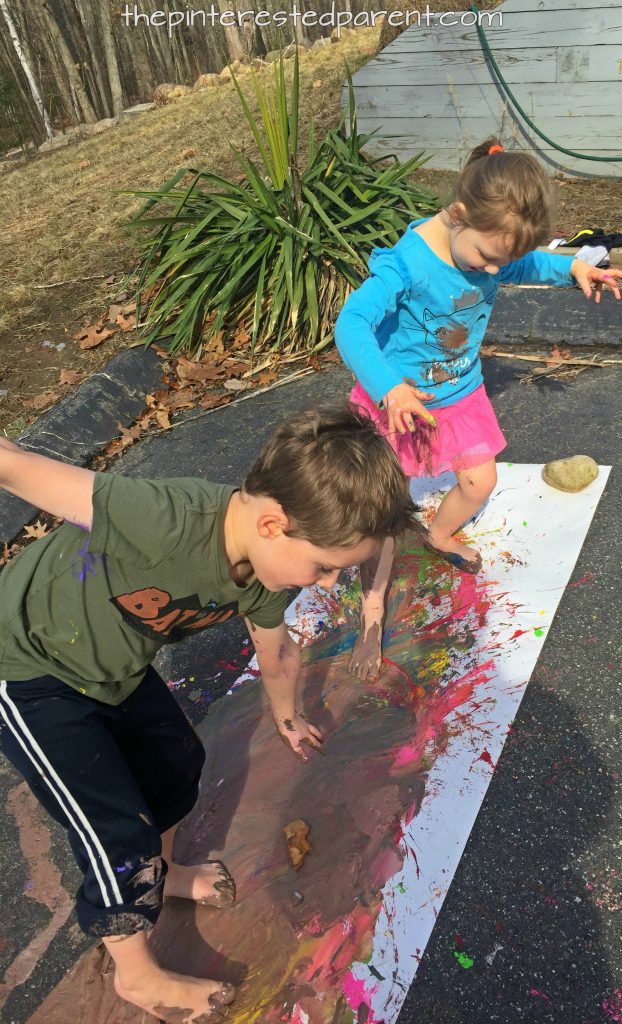 Messy paint play for the kids. Paint with hands and feet. Messy process art & play