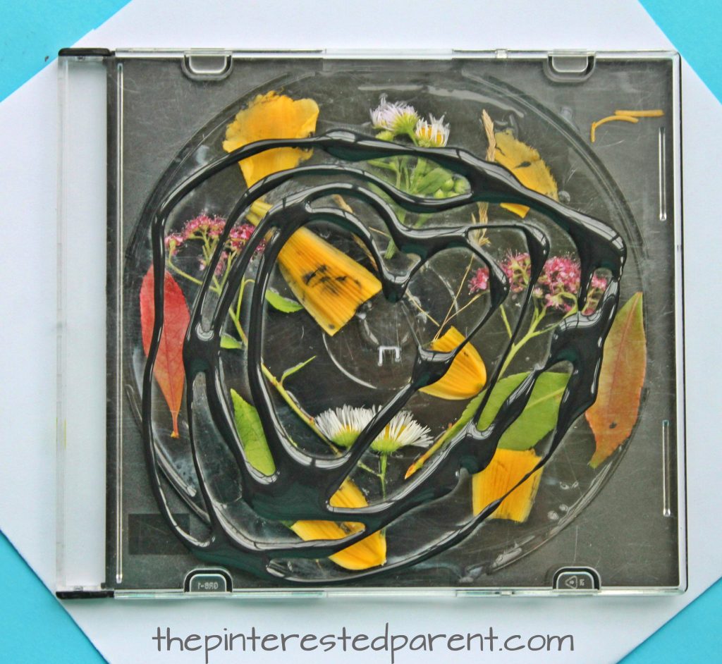 Turn an old CD case into something fun. CD Case artwork for kids. Make suncatchers or beautiful nature art with black glue. Arts and crafts with recyclables for kids.