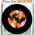 Paper plate swinging flying bats sun catcher - Halloween arts & crafts for kids.