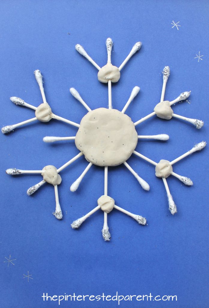 These Q-tip snowflake crafts are great for fine motor skills - Winter & Christmas arts and crafts for kids
