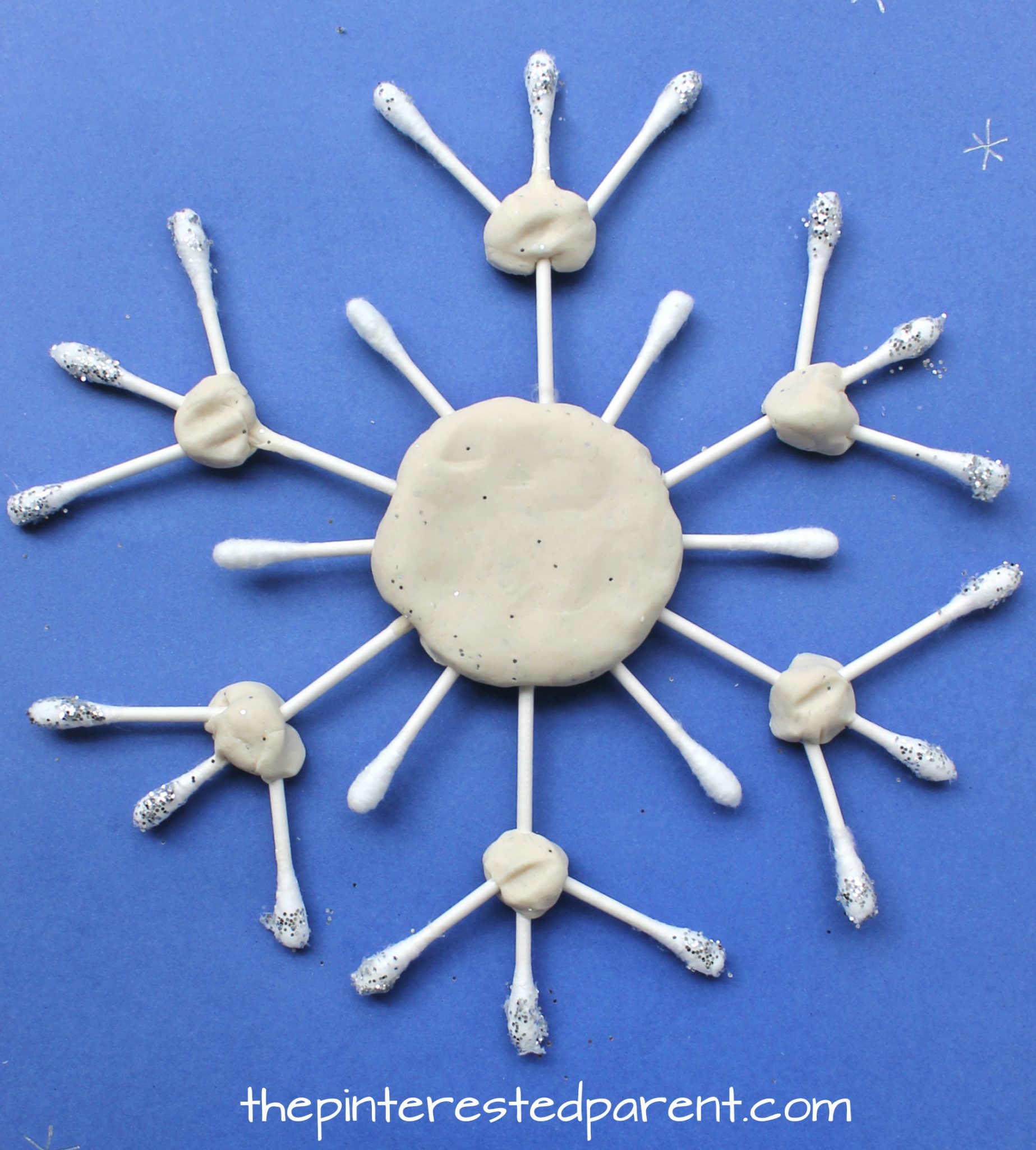 These Q-tip snowflake crafts are great for fine motor skills - Winter & Christmas arts and crafts for kids