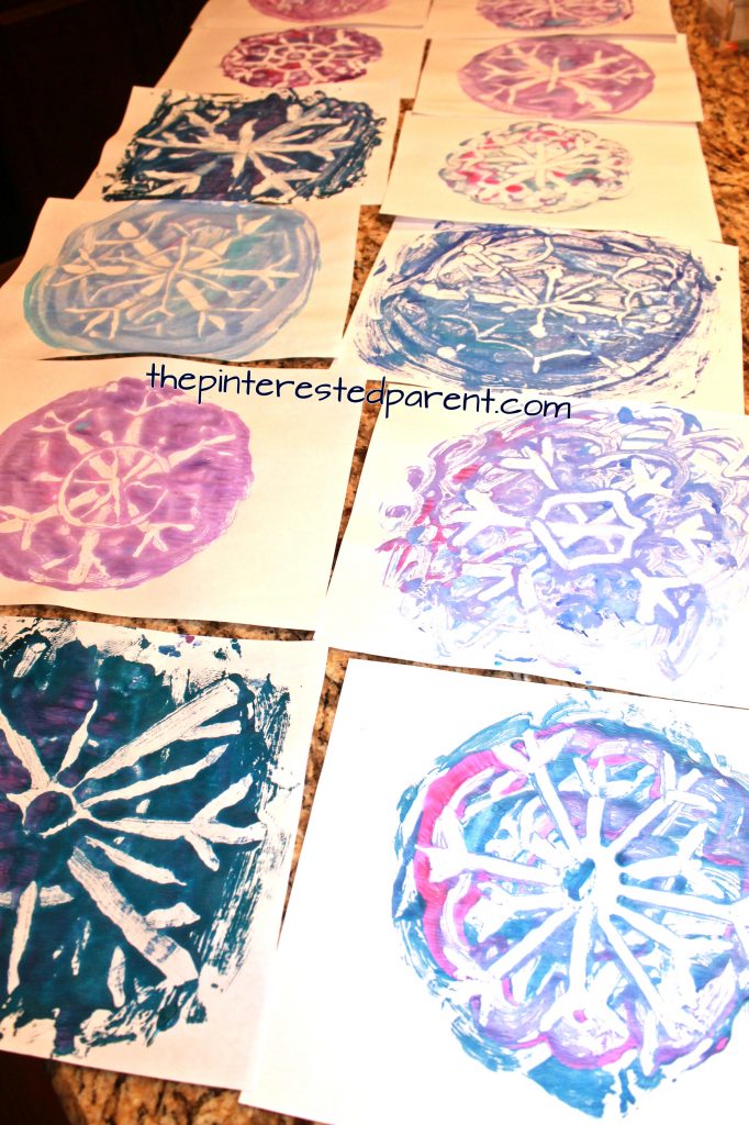 Negative space tin foil snowflake prints . Winter & Christmas arts & crafts for kids. Printmaking ideas